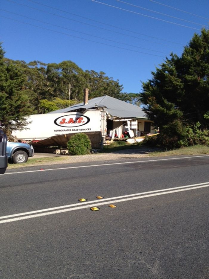 Truck crashes into house